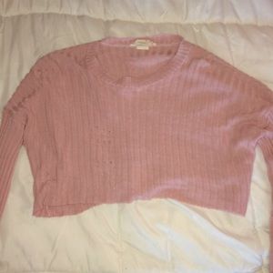 pink cropped long sleeve shirt